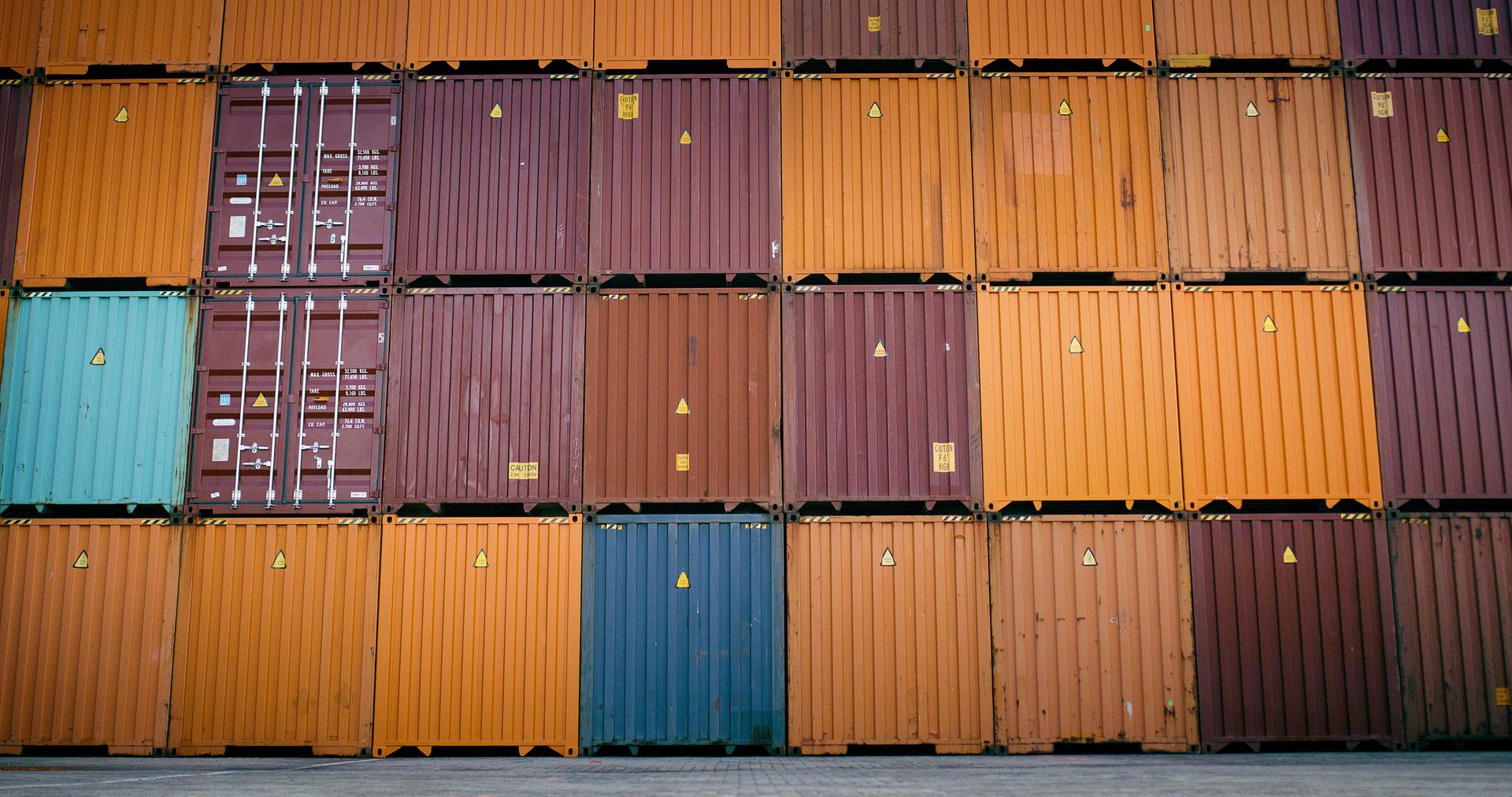 Containers, import and shipping with delivery, stack and cargo with pattern, texture and box. Empty, logistics and industry with international trade, storage or freight with commerce, stock or harbor